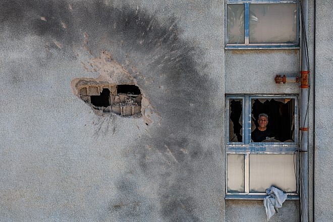 The damage after a rocket fired from Hezbollah in Lebanon hit a building in the northern Israeli town of Kiryat Shmona on Feb. 11, 2024. Photo by David Cohen/Flash90.