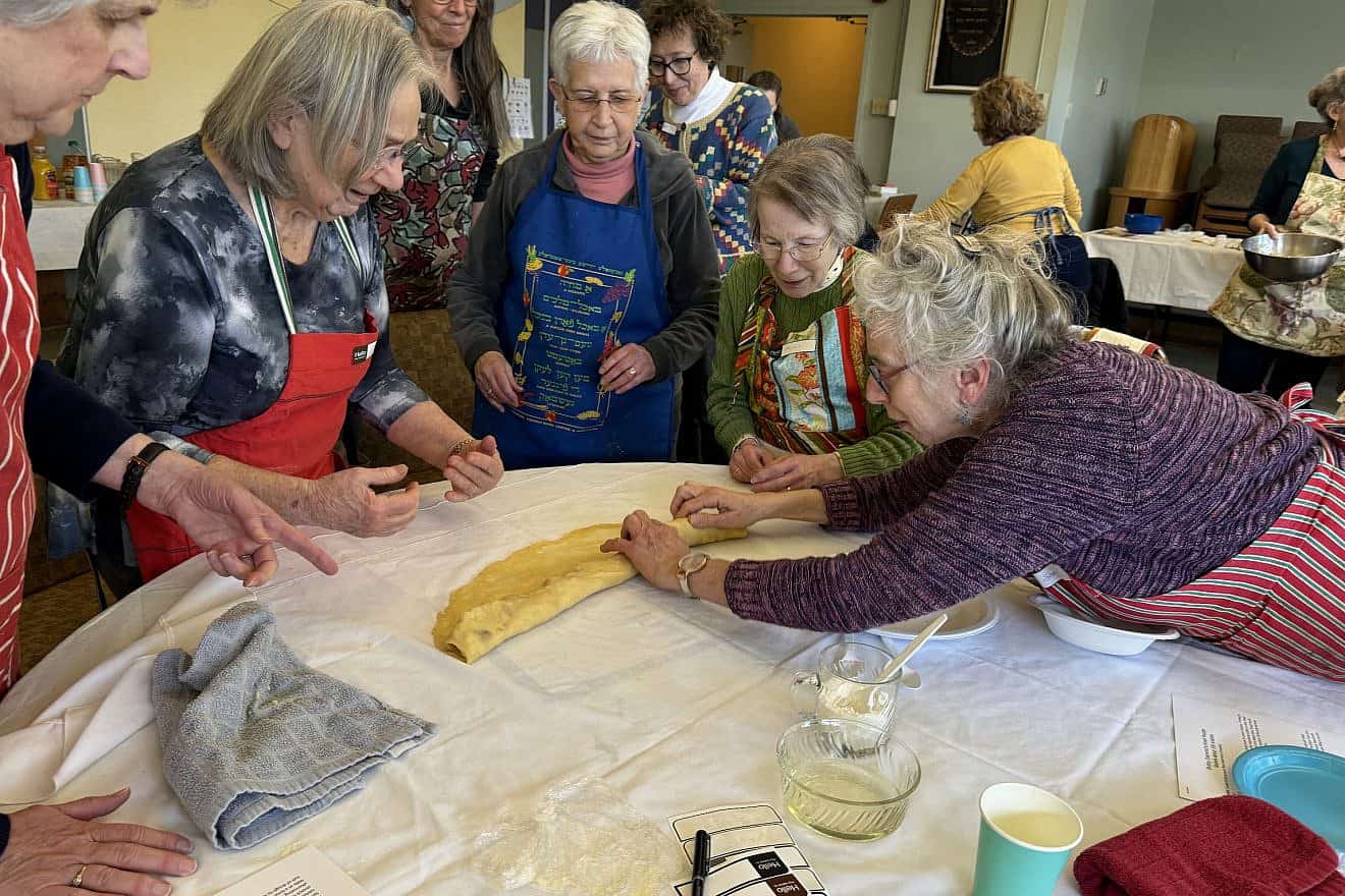 Author Yona Diamond Dansky teaches a group of students how to make knishes. Credit: Courtesy of Yona Diamond Dansky.