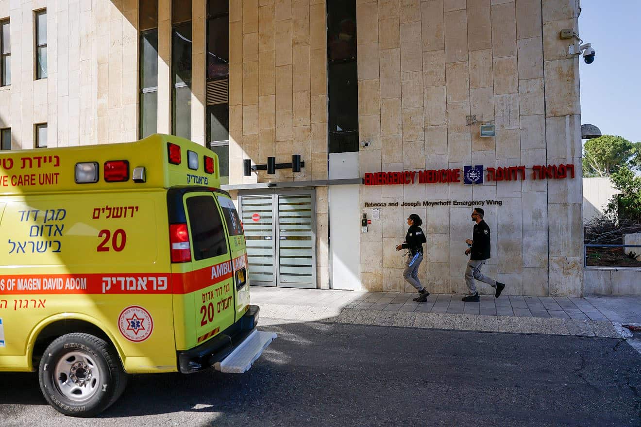 Security guards near the ambulance that brought wounded citizens from a terror attack in the Jordan Valley to Hadassah Hospital-Mount Scopus in Jerusalem on March 28, 2024. Photo by Chaim Goldberg/Flash90.