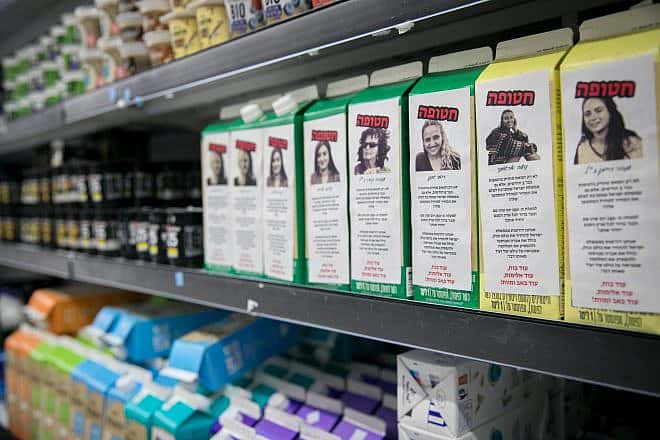 Stickers with photos and descriptions of Israelis still being held hostage by Hamas terrorists in the Gaza Strip, been posted on milk cartons at a supermarket in Tel Aviv, March 20, 2024. Photo by Miriam Alster/Flash90.