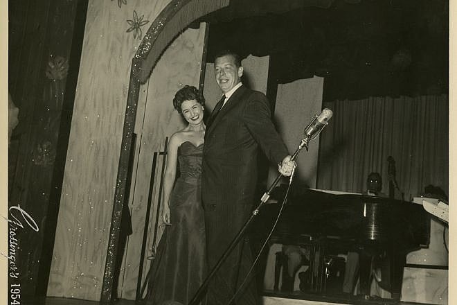 Milton Berle with an unnamed woman at Grossinger's Country Club in the Catskills in 1954. Credit: YIVO Institute for Jewish Research.