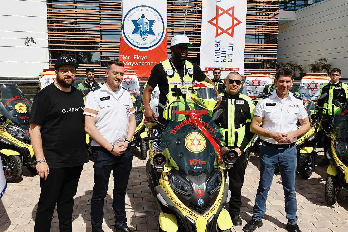 Floyd Mayweather Jr. with one of the ambucycles during a visit to Magen David Adom's Marcus National Blood Services Center in Ramle on March 13, 2024. Credit: MDA.