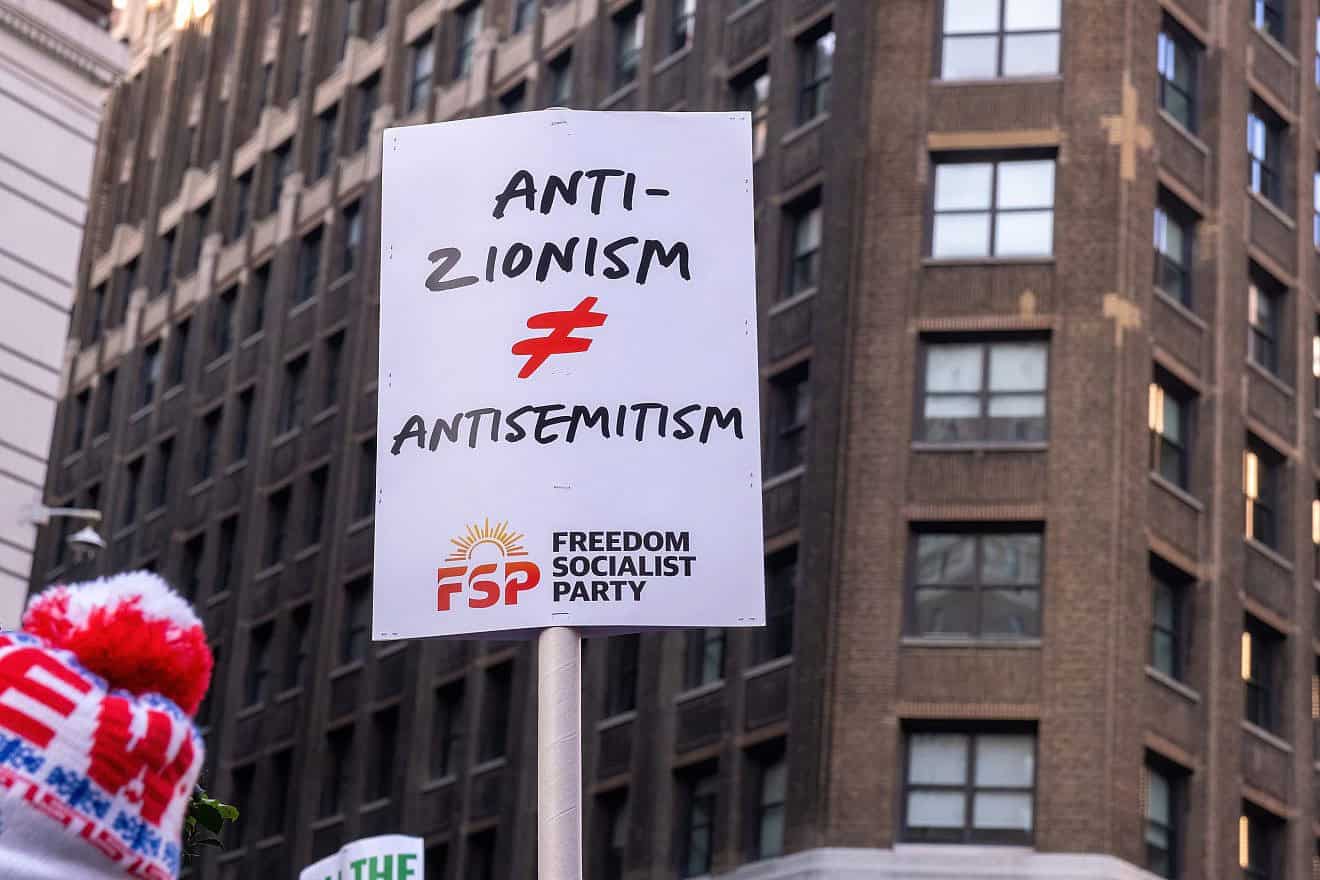 Pro-Palestinan protesters gather in Herald Square in New York City for a “March for the Martyrs” rally, showing a sign: “Anti-Zionism Does Not Equal Antisemitism,” Dec. 16, 2023. Credit: Syndi Pilar/Shutterstock.