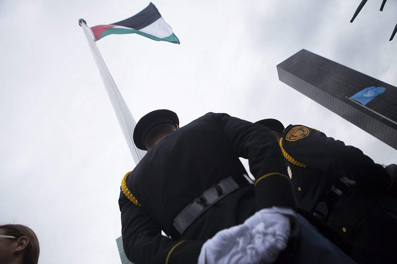A Palestinian flag is raised at the United Nations headquarters in New York, Sept. 30, 2015. Photo by Amir Levy/Flash90.