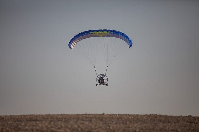 A paraglider flies near the Dead Sea in Israel, Aug. 2, 2019. Photo by Aharon Krohn/Flash90.