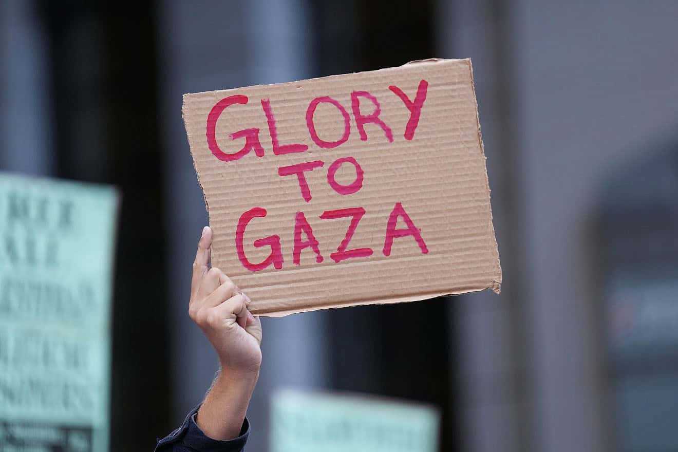 A “Glory to Gaza” sign held by pro-Palestinian protesters after the Hamas terrorist attacks in southern Israel on Oct. 7, 2023. Credit: Phil Pasquini/Shutterstock.