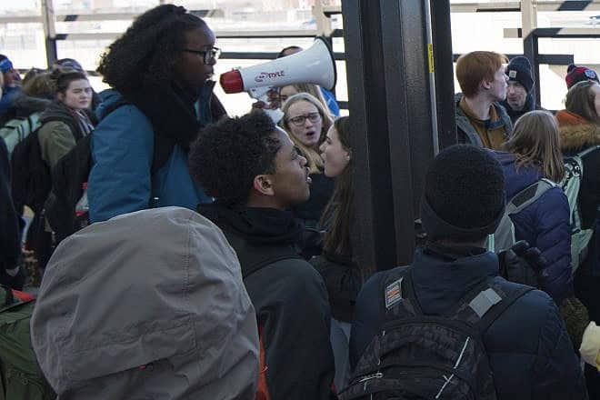 Isra Hirsi, Isra Hirsi, the daughter of Rep. Ilhan Omar (D-Minn.), leads a group of students from South High School in Minneapolis in a protest against gun violence on Feb. 21, 2018. Credit: Fibonacci Blue via Wikimedia Commons.