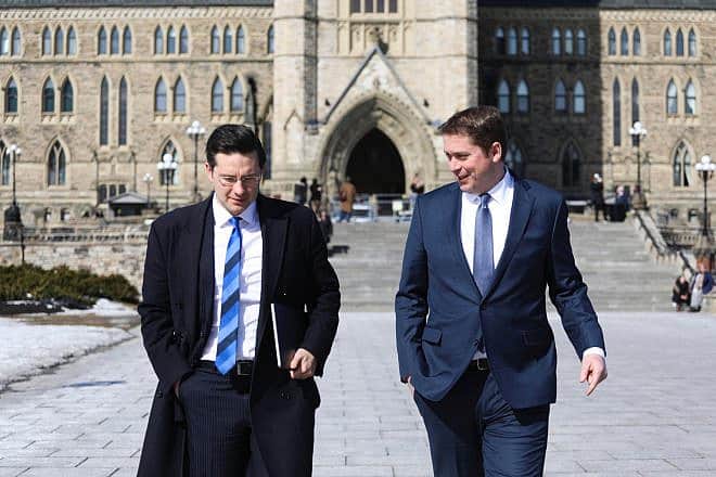 Canadian Parliament member Pierre Poilievre (left) of the Conservative Party with colleague MP Andrew Scheer on Parliament Hill in downtown Ottawa, Ontario, on Feb. 28, 2018. Credit: Flickr via Wikimedia Commons.