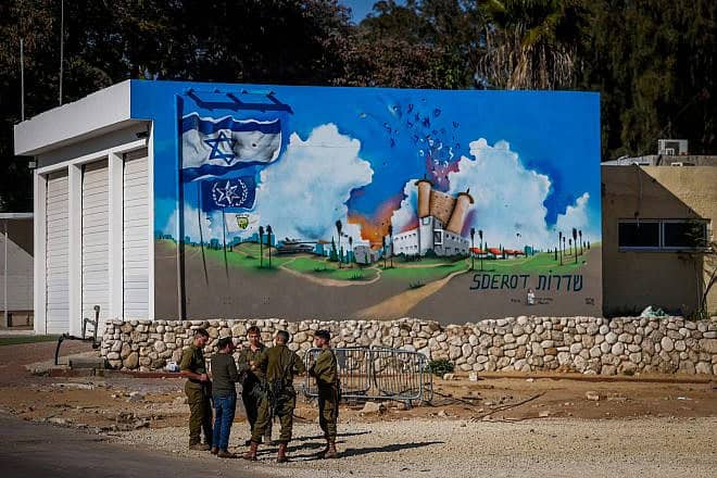 Israeli soldiers stand near graffiti at the site of the old police station in the southern Israeli city of Sderot, which was attacked on Oct. 7 by Hamas terrorists, March 11, 2024. Photo by Chaim Goldberg/Flash90.
