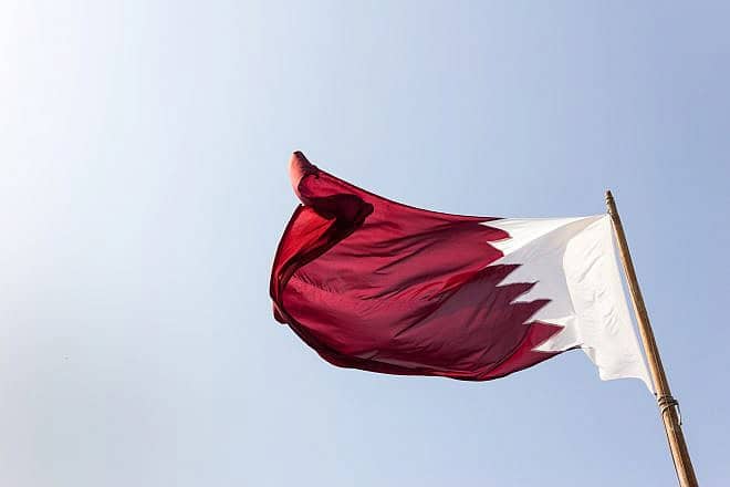 The flag of Qatar. Credit: Mark Hilton/Shutterstock.