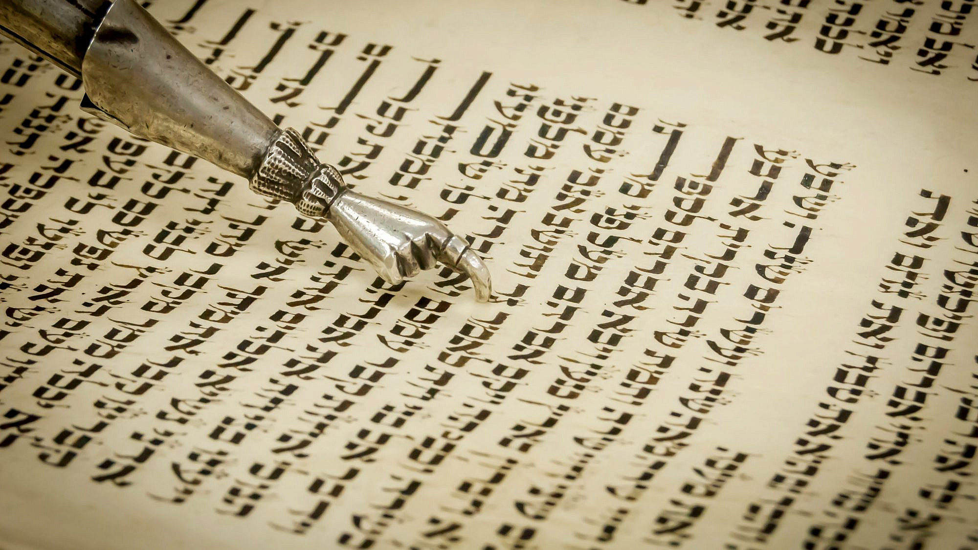 Torah pointer (yad) marking the place early on in Chayei Sarah, the fifth parsha in the book of Genesis. Credit: Roman Yanushevsky/Shutterstock.