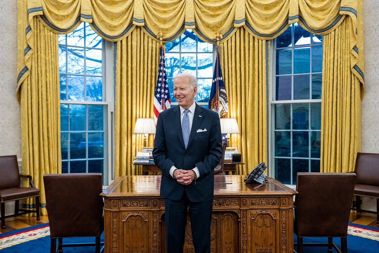 President Joe Biden prepares to greet the family of departing U.S. Army Military Aide Maj. Bill Yang in the Oval Office of the White House on Jan. 20, 2023. Photo by Cameron Smith/White House.