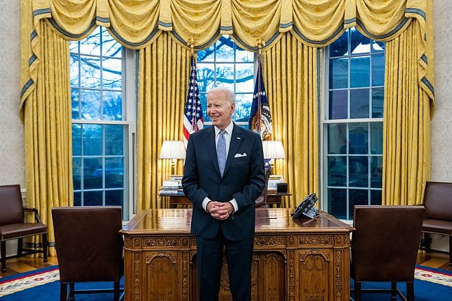 President Joe Biden prepares to greet the family of departing U.S. Army Military Aide Maj. Bill Yang in the Oval Office of the White House on Jan. 20, 2023. Photo by Cameron Smith/White House.