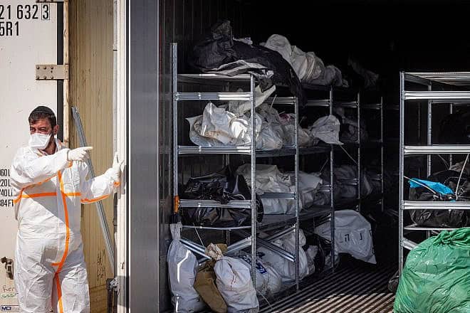 ZAKA personnel and Israeli soldiers at the forensic center in the Shura military base near Ramle, where hundreds of dead bodies arrived after Hamas's Oct. 7 massacre, Oct. 13, 2023. Photo by Nati Shohat/Flash90.