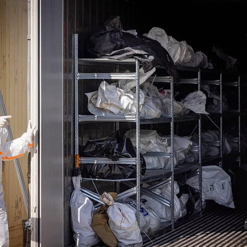 ZAKA personnel and Israeli soldiers at the forensic center in the Shura military base near Ramle, where hundreds of dead bodies arrived after Hamas's Oct. 7 massacre, Oct. 13, 2023. Photo by Nati Shohat/Flash90.