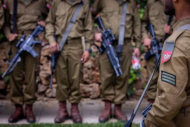 Israeli soldiers from the Netzah Yehuda Battalion visit graves of fallen Israeli soldiers at Mount Herzl Military Cemetery in Jerusalem, on May 12, 2024, ahead of Israeli Memorial Day, May 12, 2024. Photo by Chaim Goldberg/Flash90.