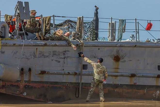 U.S. military personnel at a U.S. Army vessel that washed up on the beach in Ashdod, May 25, 2024. Photo by Liron Moldovan/Flash90.