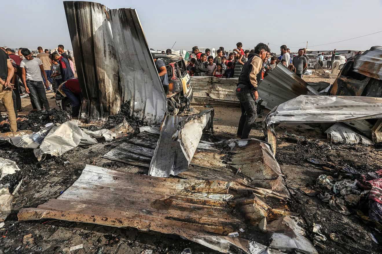 Palestinians inspect damage after an Israeli airstrike west of Rafah in the southern Gaza Strip, May 27, 2024. Photo by Abed Rahim Khatib/Flash90.