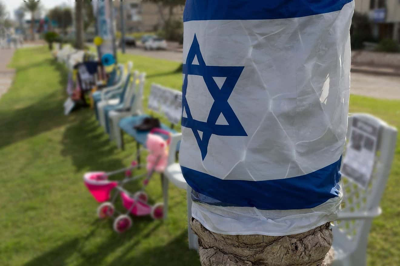 The Israeli flag posted near a U.S. rally for the release of hostages Hamas kidnapped from Israel and have kept captive in the Gaza Strip. Credit: Taurus Y/Shutterstock.