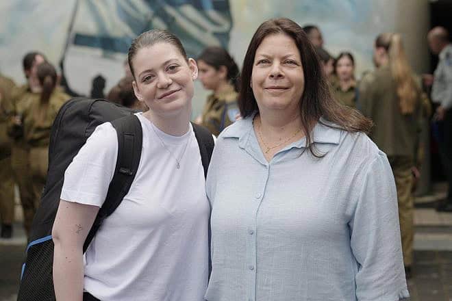 Former Gaza hostages Noga (left) and Shiri Weiss at an Israel Defense Forces recruitment center, May 6, 2024. Credit: IDF.