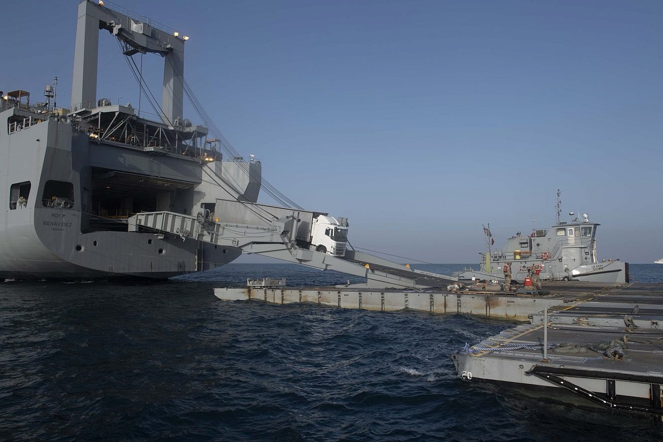 Aid trucks driving onto the U.S.-built temporary floating pier off the Gaza coast, May 17, 2024. Credit: U.S. Central Command.