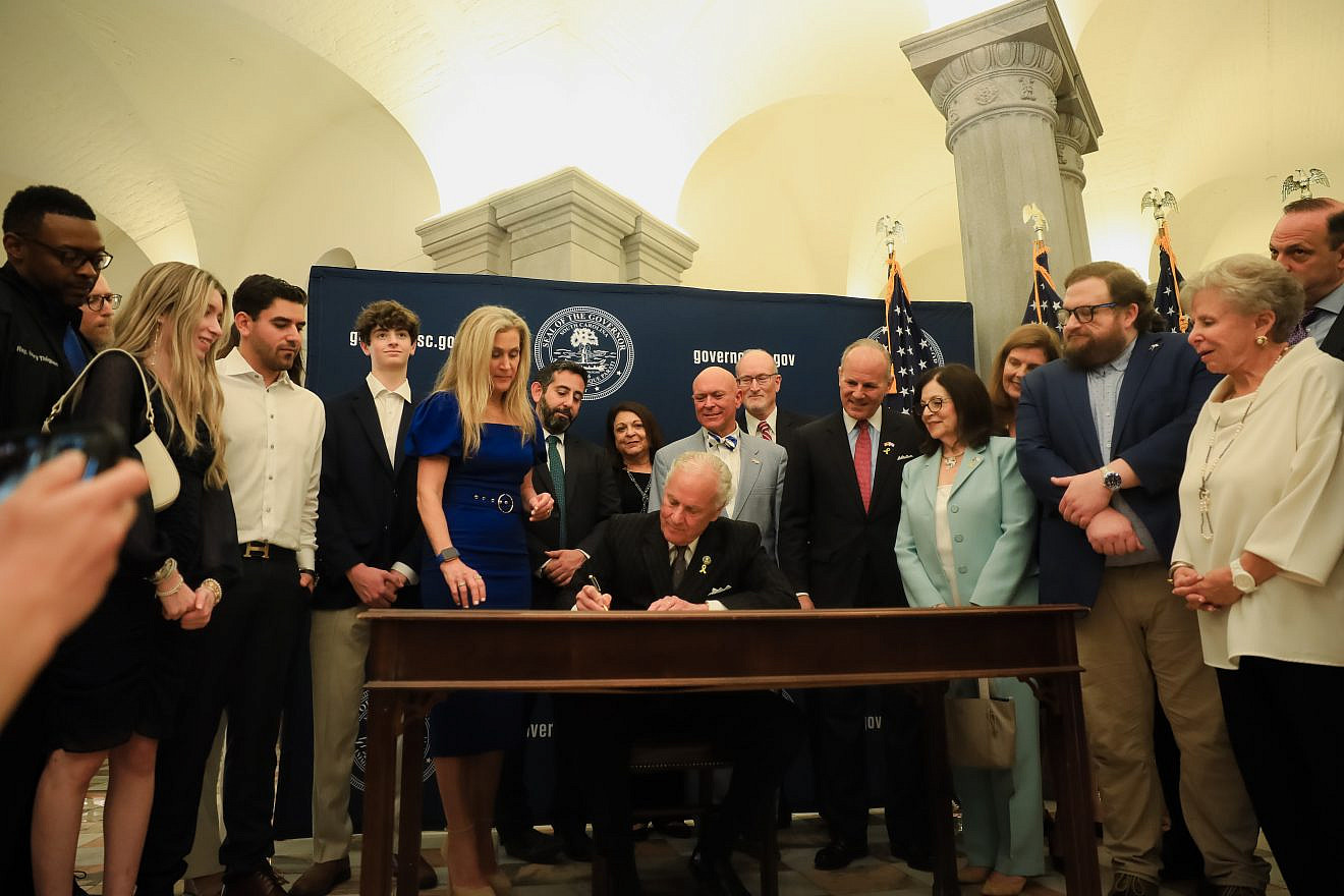 South Carolina Gov. Henry McMaster signs a bill into law codifying the IHRA working definition of antisemitism on May 23, 2024. Credit: S.C. Governor's Office.