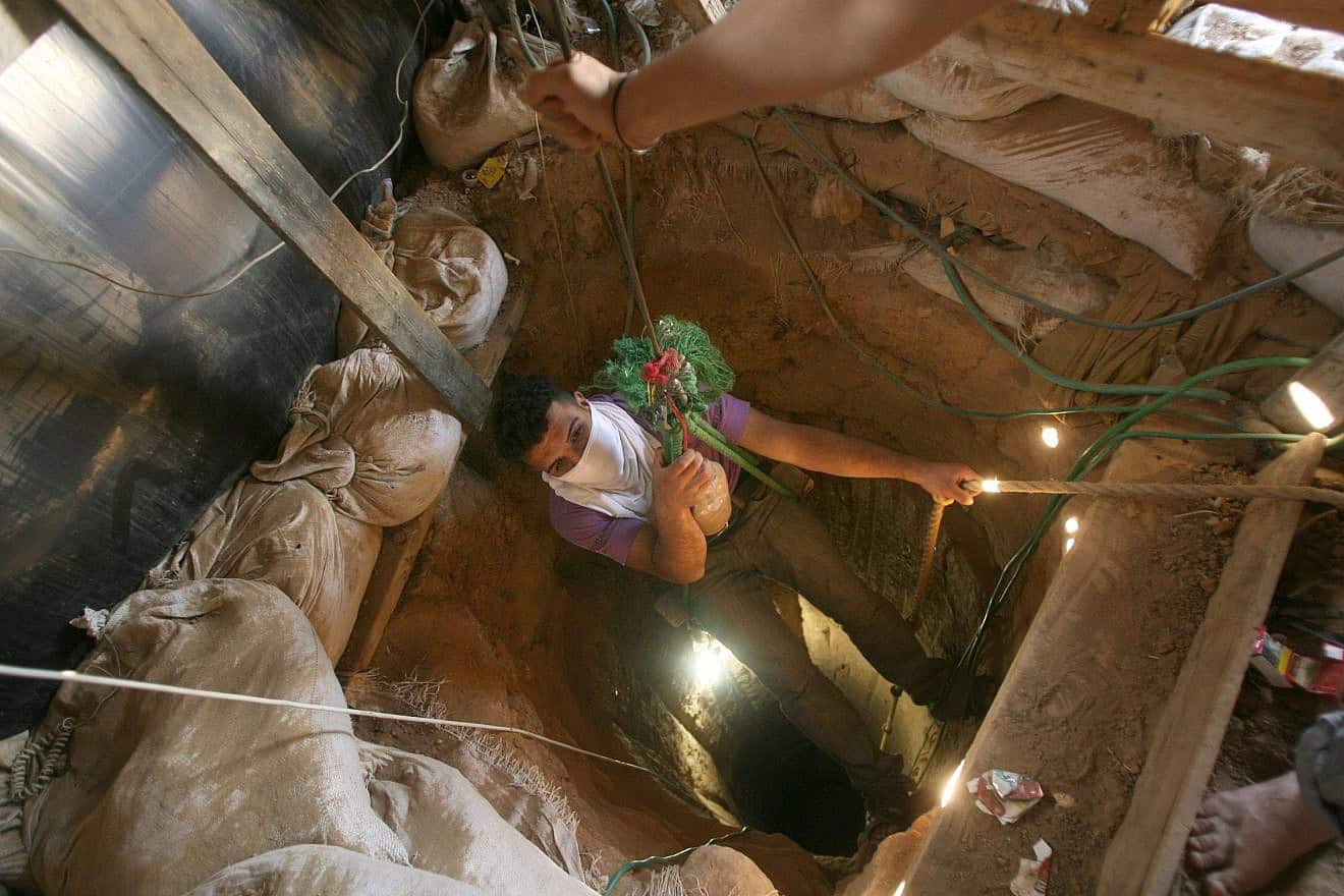 A Palestinian smuggler enters a tunnel in the southern Gaza Strip town of Rafah, April 14, 2010. Photo by Abed Rahim Khatib/Flash90.