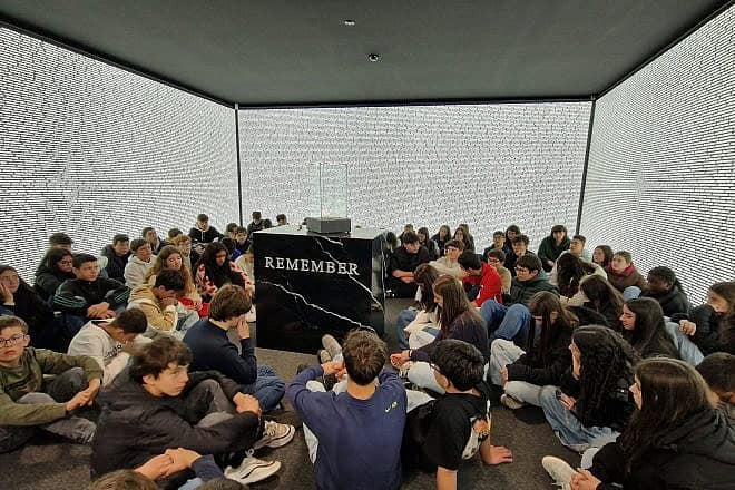 Portuguese schoolchildren in the Room of Names at the Holocaust Museum of Oporto hold a moment of silence, May 3, 2024. Credit: Jewish Community of Oporto.