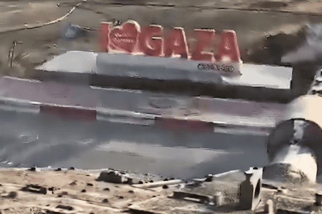 An Israel Defense Forces tank crushes an "I heart Gaza sign" at the Rafah Border Crossing in the Strip, May 7, 2024. Credit: Screenshot.