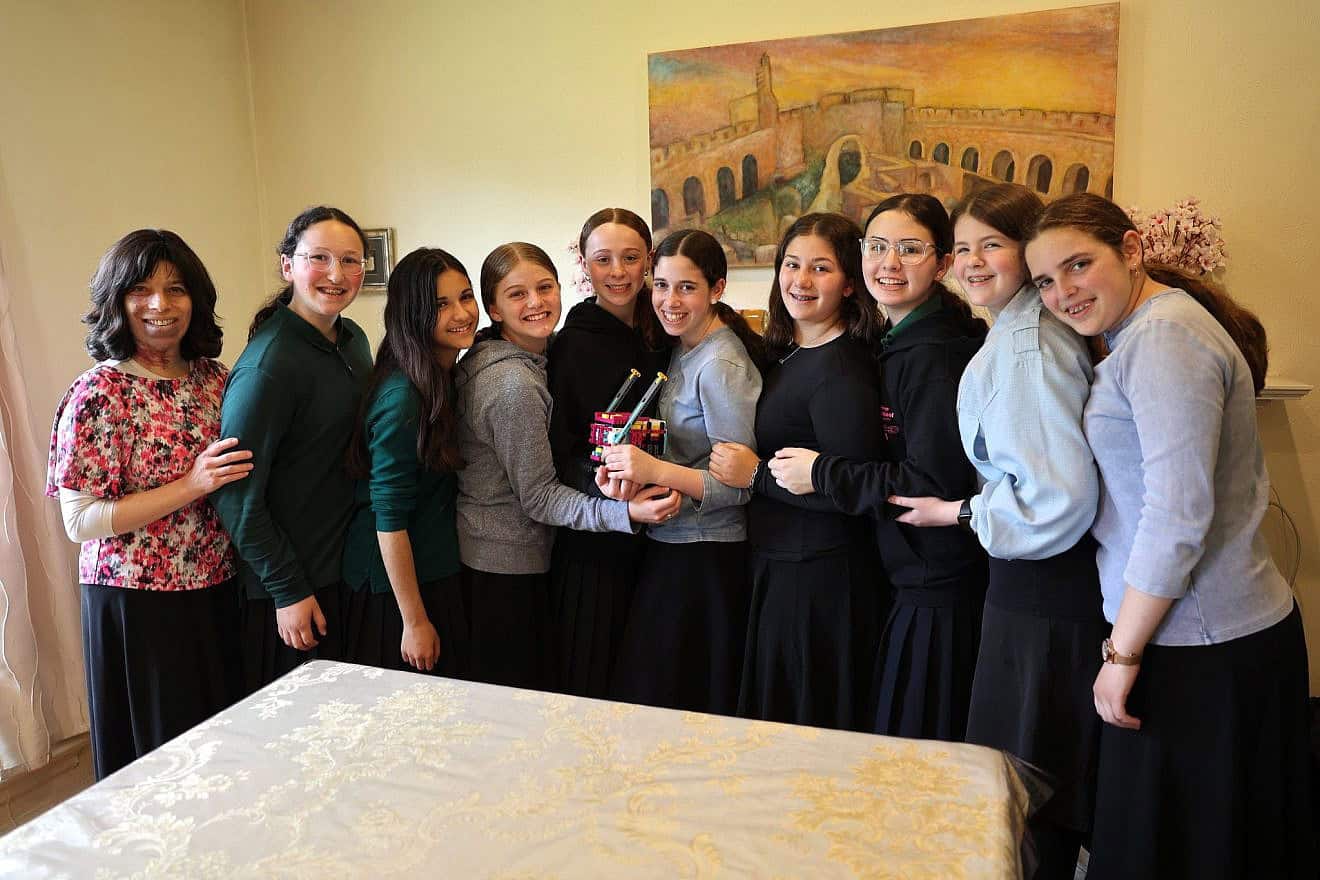 The Torah Prep robotics team, from left: Adviser Bella Bloom with students Basya Miller, Tzivi Glickfield, Rachelli Goldenhersh, Tzofia Bloom, Chaya Kass, Chana Sasportas, Nili Schuss, Malka Rosner and Esti Botuck. Photo by Bil Motchan,