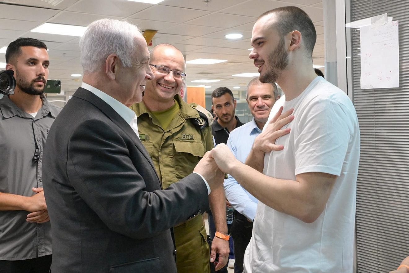 Israeli Prime Minister Benjamin Netanyahu meets with rescued hostage Andrey Kozlov at Sheba Medical Center in Ramat Gan, June 8, 2024. Credit: Maayan Toaf/GPO.