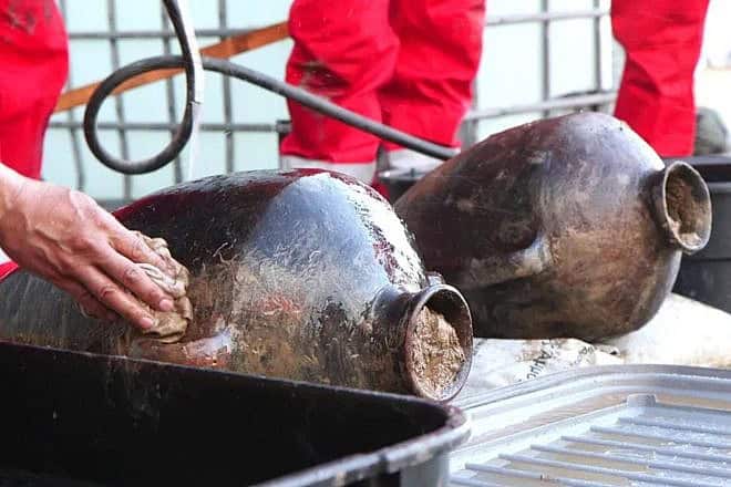 Canaanite jars are exposed to daylight after more than 3,300 years on the bottom of the Mediterranean Sea. Photo: Emil Aladjem / Israel Antiquities Authority.