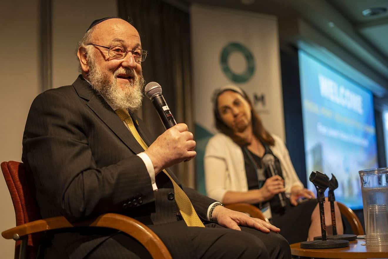 Rabbi Ephraim Mirvis, chief rabbi of the United Hebrew Congregations of the Commonwealth. addressing the Focal Point Conference in New York City alongside OLAM CEO Dyonna Ginsburg, May 2024. Photo by Jesse Kornbluth/OLAM.