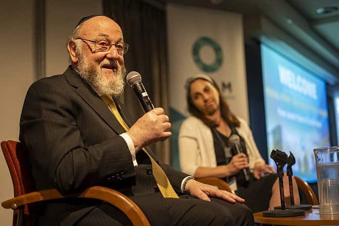 Rabbi Ephraim Mirvis, chief rabbi of the United Hebrew Congregations of the Commonwealth. addressing the Focal Point Conference in New York City alongside OLAM CEO Dyonna Ginsburg, May 2024. Photo by Jesse Kornbluth/OLAM.