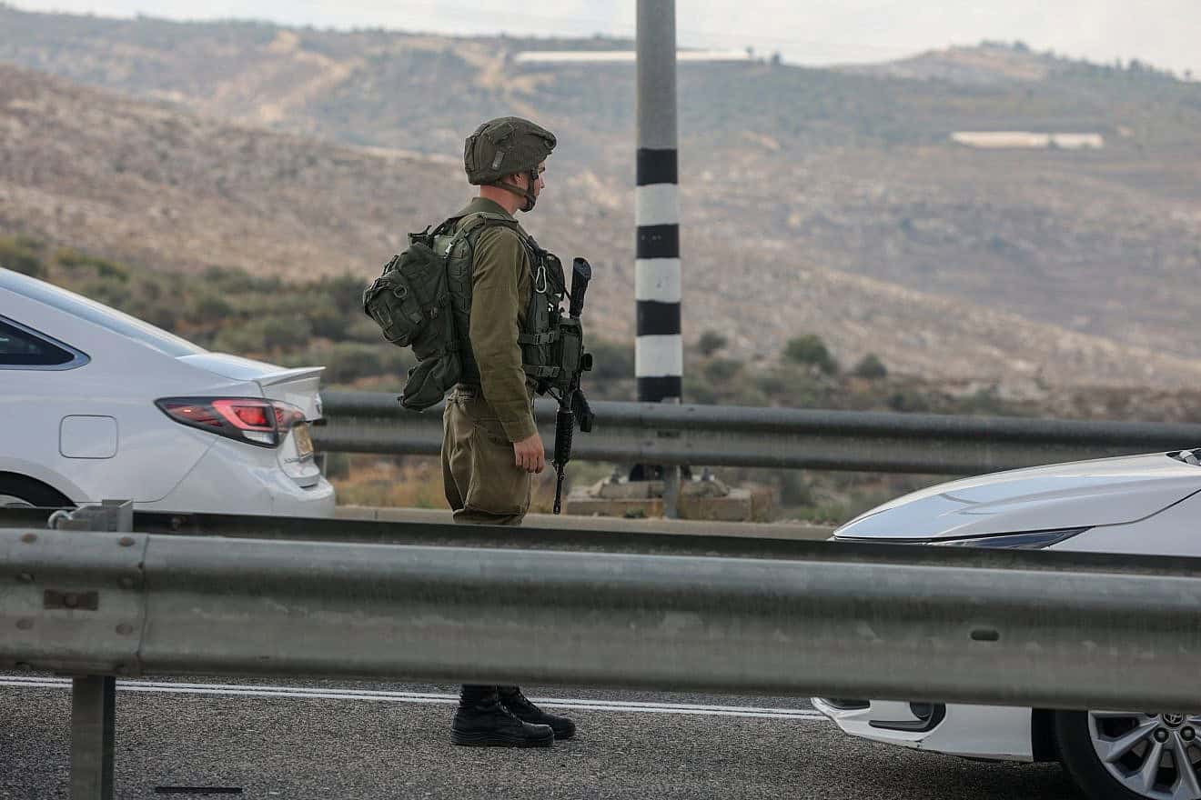 Israel Defense Forces troops at the scene of a car-ramming attack at the Maccabim Crossing near Modiin in central Israel, Nov. 2, 2022. Photo by Flash90.
