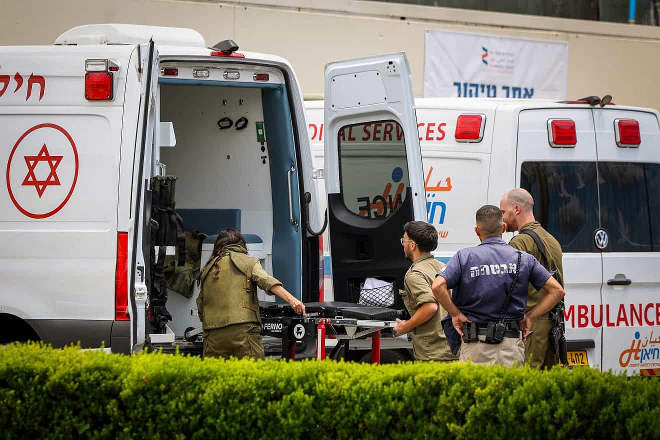 Israeli soldiers seen outside Ziv Medical Center in Safed after evacuating a wounded man, June 23, 2024. Photo by David Cohen/Flash90.
