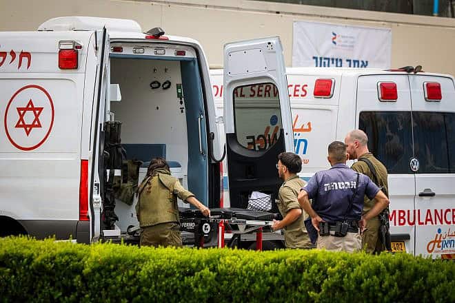 Israeli soldiers seen outside Ziv Medical Center in Safed after evacuating a wounded man, June 23, 2024. Photo by David Cohen/Flash90.