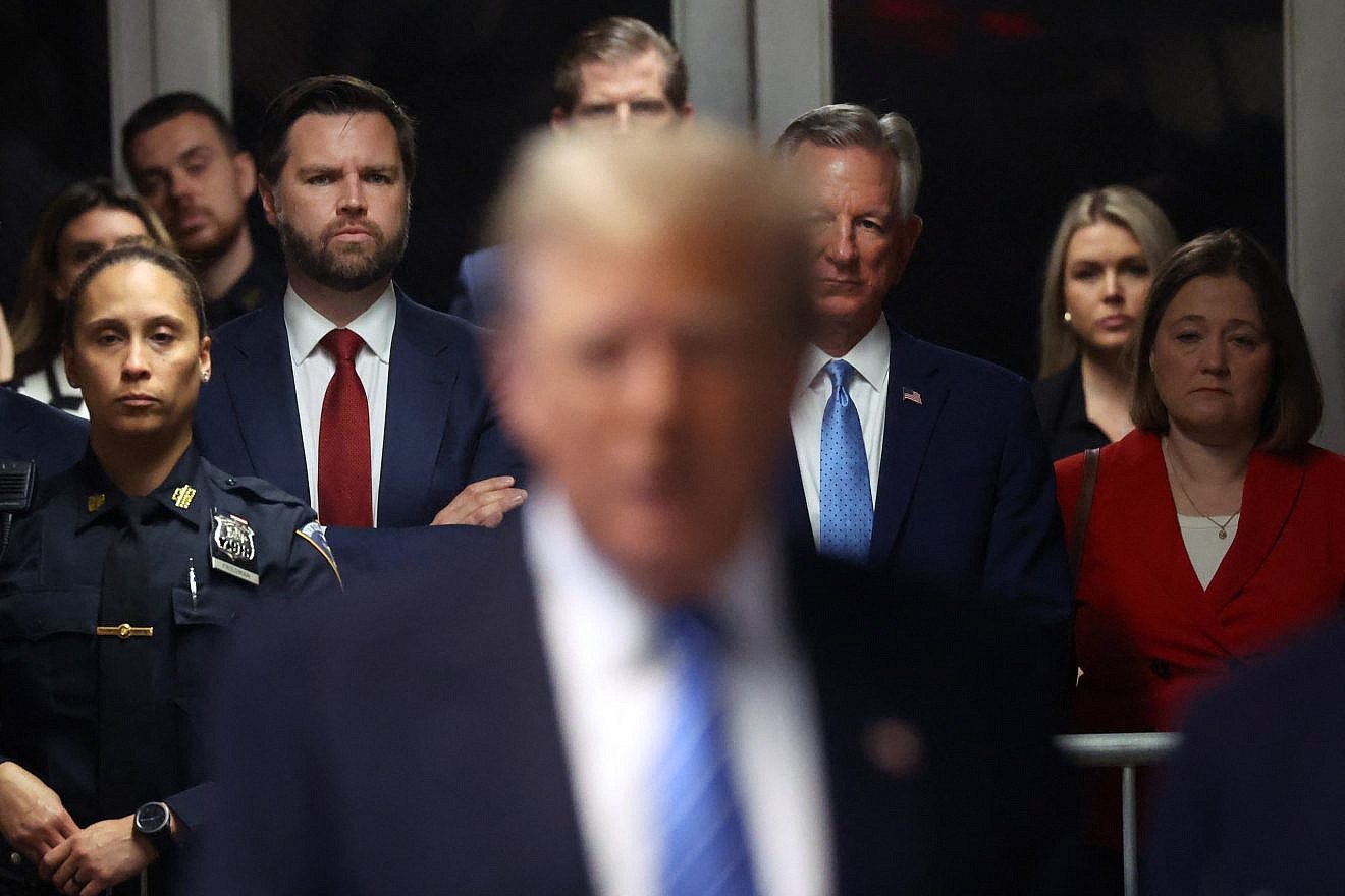 Former President Donald Trump speaks to the press at his trial for allegedly covering up hush money payments as (left, red tie) Sen. J.D. Vance (R-Ohio) looks on at Manhattan Criminal Court, in New York City, May 13, 2024. Photo by Spencer Platt/POOL/AFP via Getty Images.