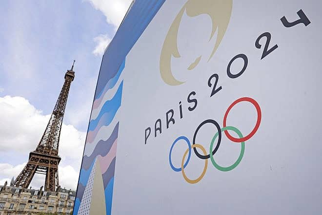 The Paris 2024 logo near the Eiffel Tower, June 17, 2024. Photo by Chesnot/Getty Images.