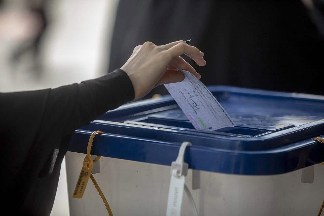Iranians cast their votes at a polling station in Tehran, Iran during the presidential election on June 28, 2024. Photo by Majid Saeedi/Getty Images.