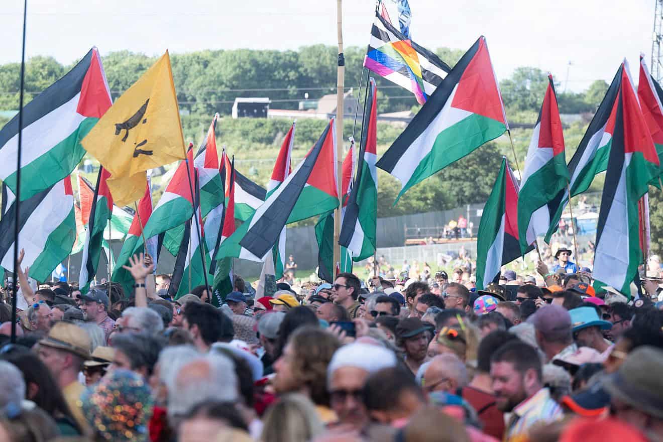 PLO flags are seen in the crowd at the Pyramid stage during day three of Glastonbury Festival 2024 at Worthy Farm, Pilton, in Glastonbury, England, June 28, 2024. Photo by Samir Hussein/WireImage via Getty Images.