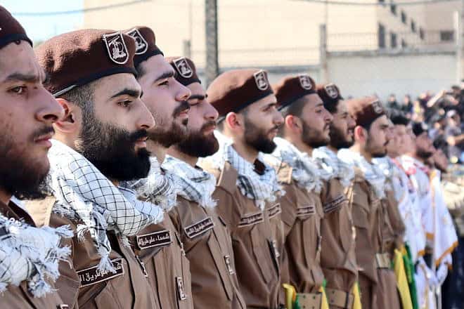 Hezbollah terrorists at a funeral for a slain comrade in Jwaya, Lebanon, April 17, ‎2024, Photo by mohammad kassir/Shutterstock.