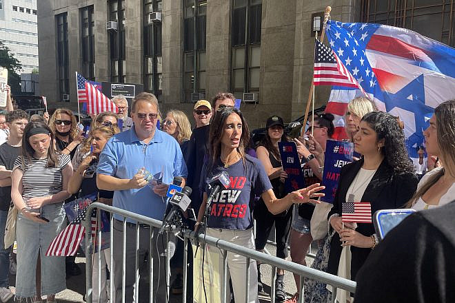 Michelle Ahdoot, director of strategy and programming at End Jew Hatred, speaks at a rally outside Manhattan District Attorney Alvin Bragg's office on June 24, 2024, alongside Alan Mindel, chairman of the board at the Holocaust Memorial and Tolerance Center of Long Island, and Eden Yadegar, president of the Columbia chapter of Student Supporting Israel. Photo by Mike Wagenheim.
