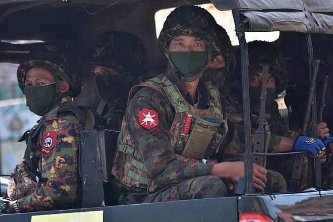 Myanmar armed forces prepare to crack down on peaceful protesters, Feb. 28, 2021. Credit: R. Bociaga/Shutterstock.