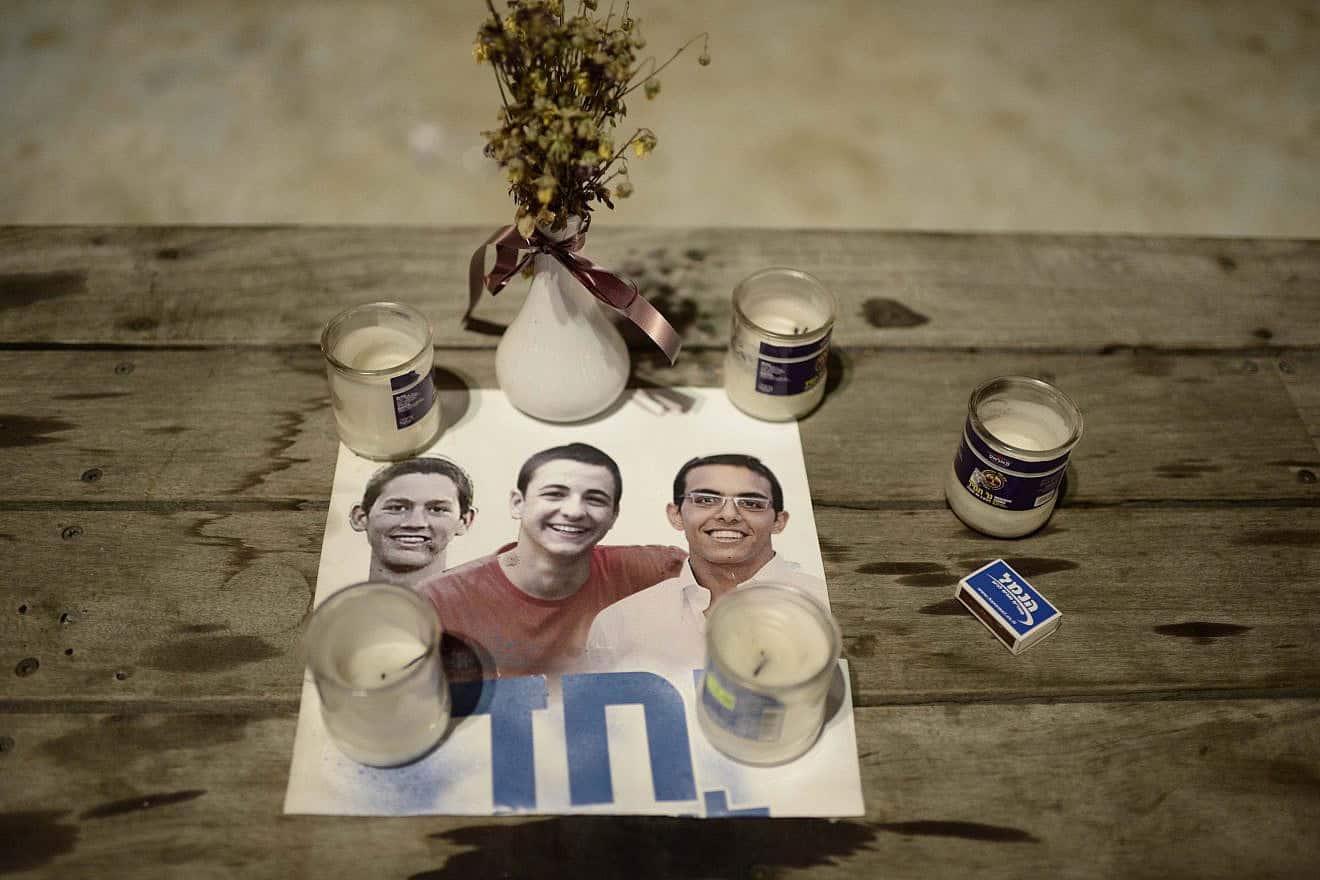 Israelis lighted candles in Tel Aviv's Rabin Square as they mourned the deaths of teenagers Naftali Fraenkel, Eyal Yifrach and Gilad Sha'ar, who were abducted and murdered by Hamas terrorists, July 6, 2014. Photo by Tomer Neuberg/Flash90.