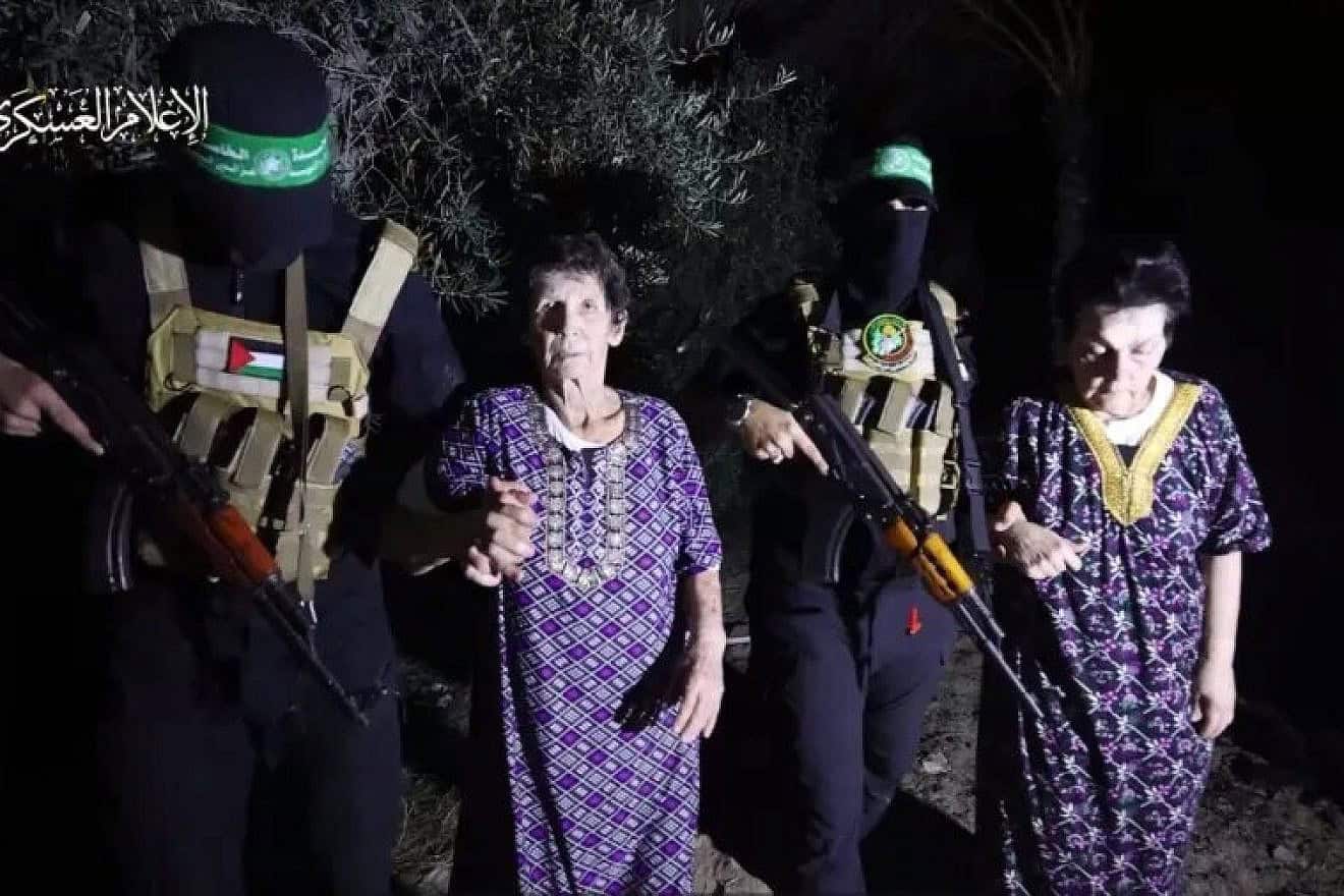 Nurit Cooper, 79, and Yocheved Lifshitz, 85, with Hamas terrorists before their “humanitarian” release, Oct. 23, 2023. Credit: Screenshot.