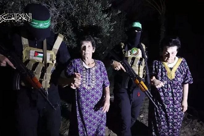 Nurit Cooper, 79, and Yocheved Lifshitz, 85, with Hamas terrorists before their “humanitarian” release, Oct. 23, 2023. Credit: Screenshot.