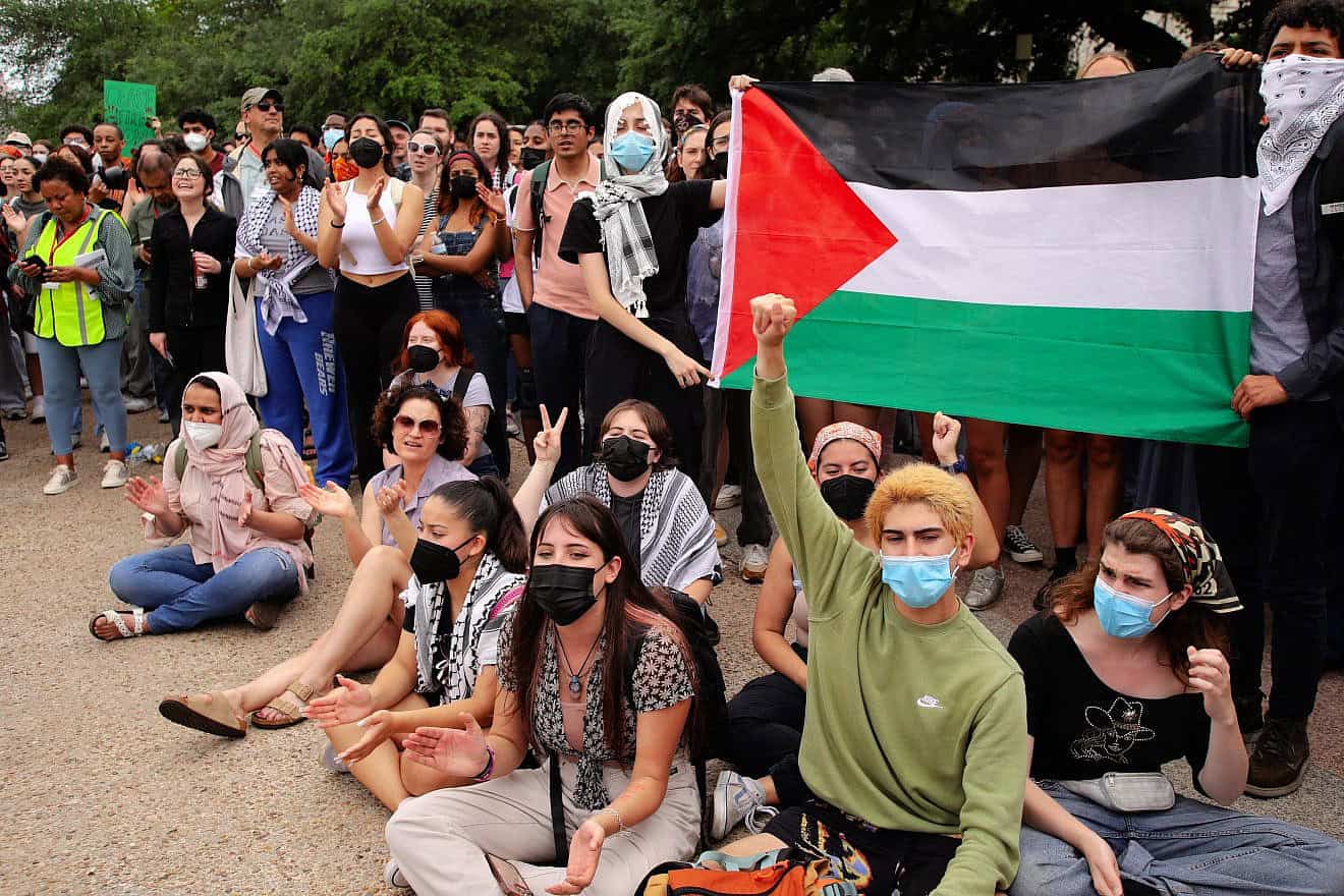 Students at the University of Texas students, many of them masked, rally for Hamas and Palestinians in the Gaza Strip in the wake of the Oct. 7 terrorist attacks in southern Israel, April 25, 2024. Credit: Vic Hinterlang/Shutterstock.