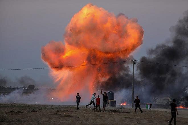 Palestinians use improvised explosive devices amid clashes with Israeli security forces in Khan Yunis, the southern Gaza Strip, following a riot near the border fence, Sept. 27, 2023. Photo by Anas-Mohammed/Shutterstock.