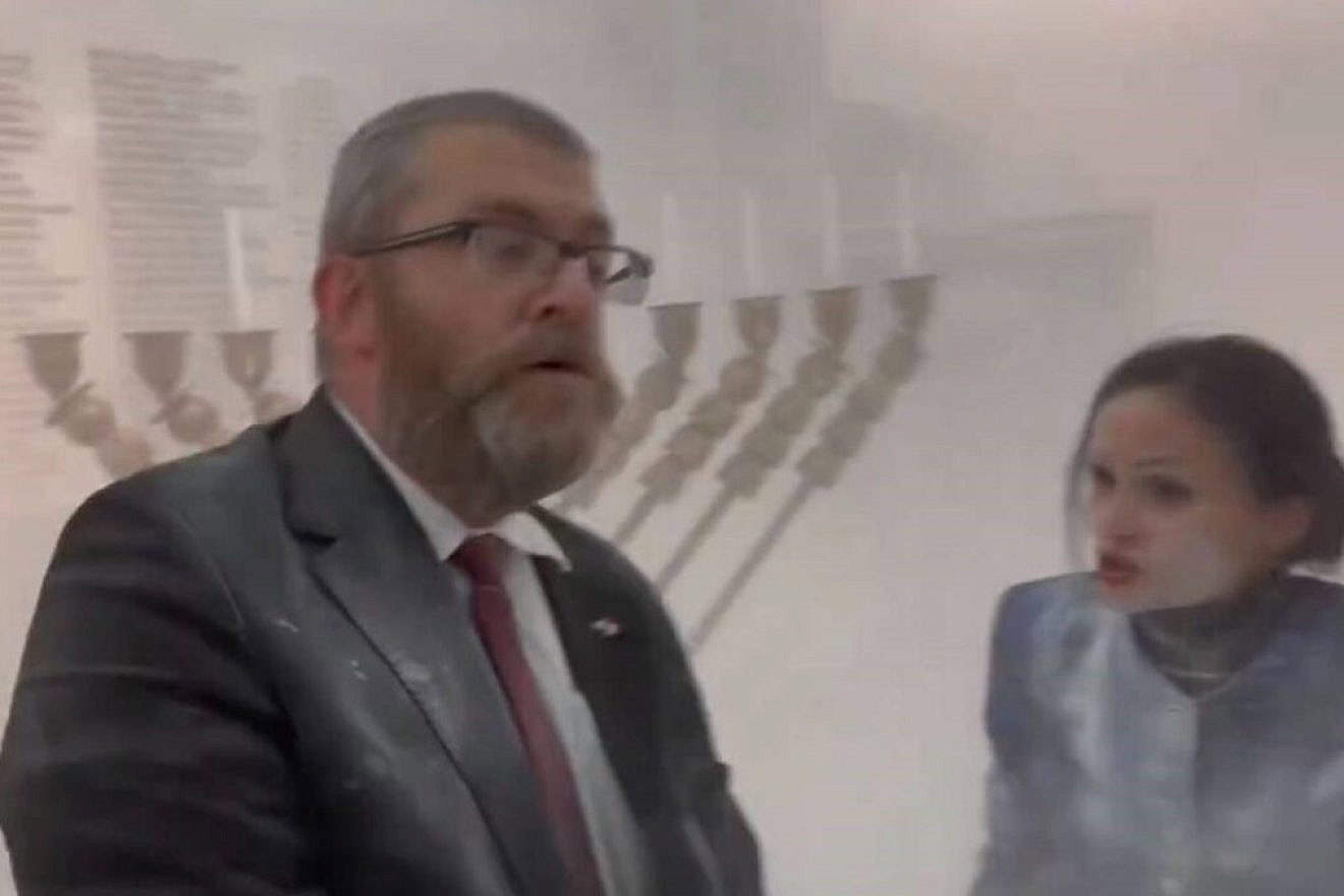 Polish lawmaker Grzegorz Braun after extinguishing a Chanukah menorah at the parliament building in Warsaw, Dec. 12, 2023. Source: Screenshot/X.